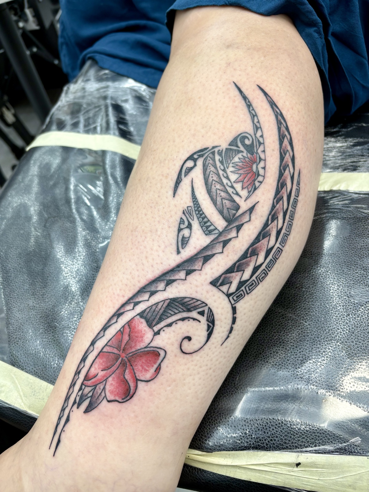 Before and after — Kevin Mokuahi's cover-up work on his partner: an aged Betty Boop piece refreshed with rose, eight-ball, and color saturation